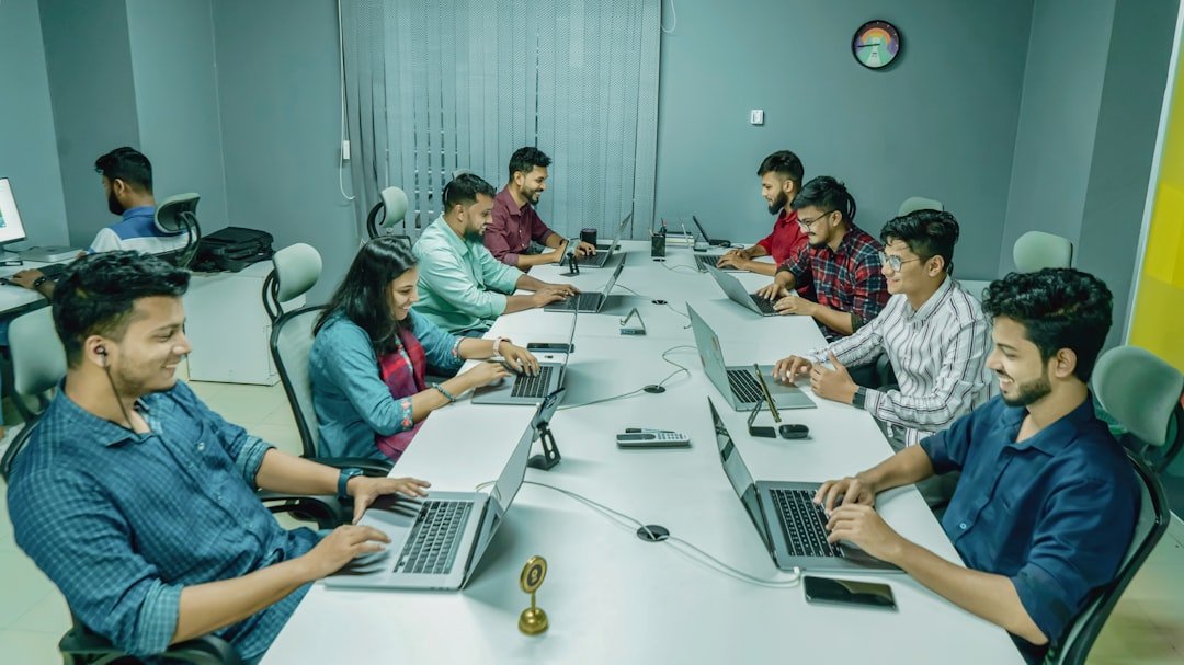 Indian business team collaborating with laptops on digital marketing strategy